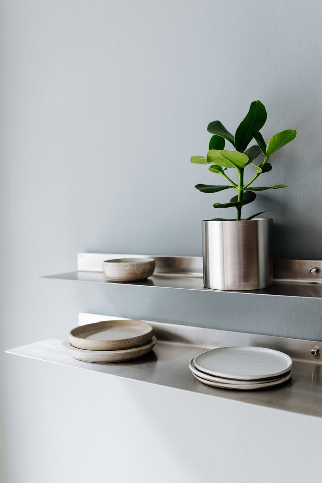 Bent stainless steel wall shelf form eisen interior