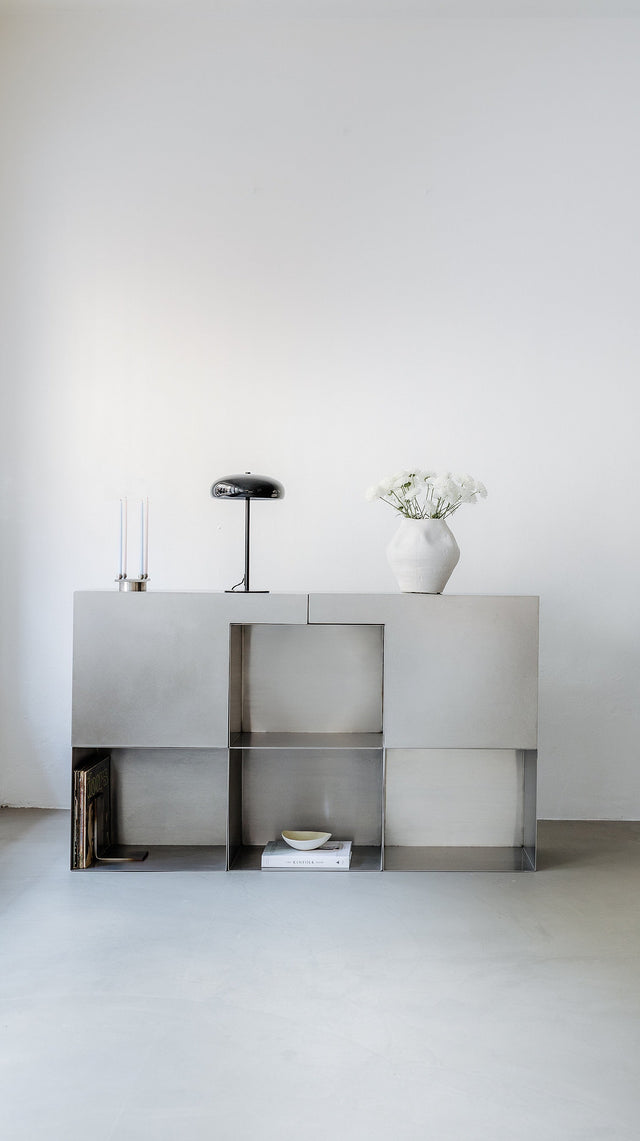Sculptural stainless steel designer system with storage space minimal design form & eisen